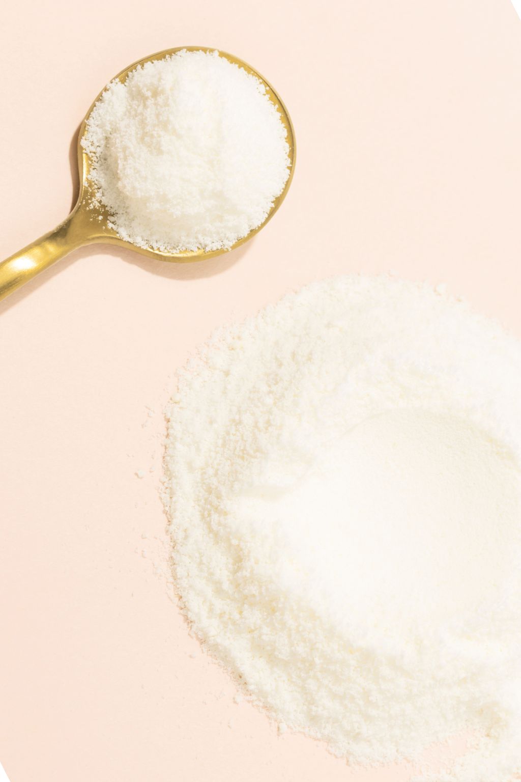 A scoop of collagen peptides—the core ingredient in Skinbiotica COLLAGEN+, a skin health supplement that supports elasticity and hydration.